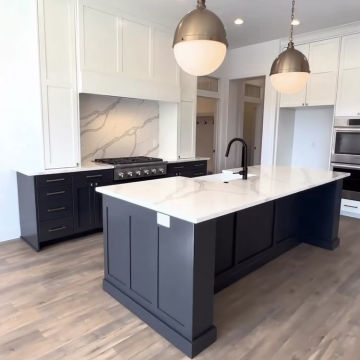 Luxury Stone Kitchen Counter with Integrated Sink and Custom Cabinets