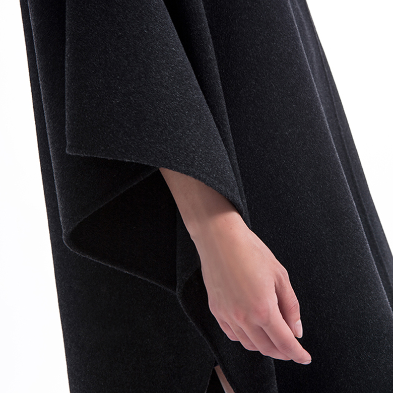Sleeves of a black cashmere overcoat