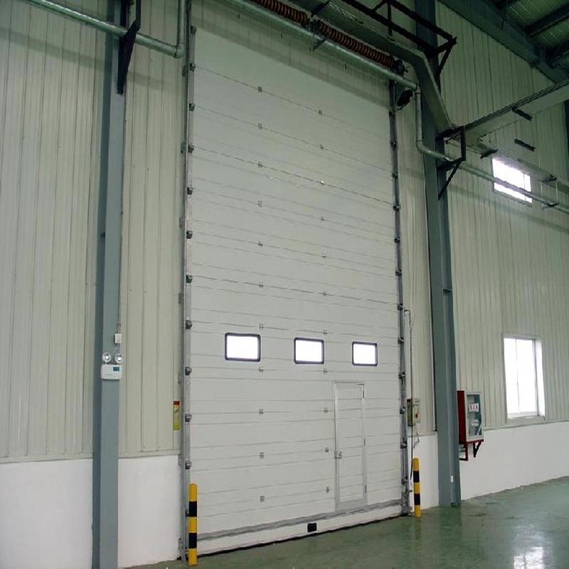 High speed vertical sectional door