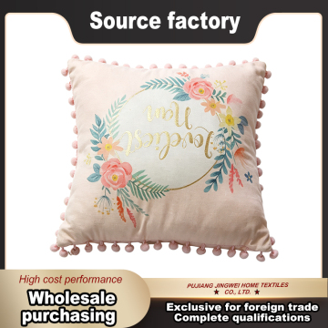 Chic Floral Wreath Cushion with Pom Pom Accents