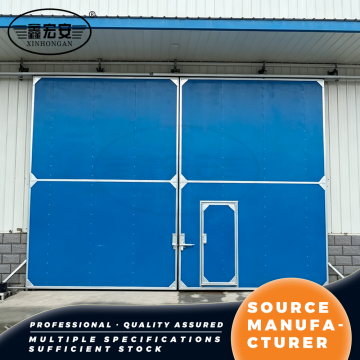 Porta industriale coibentata scorrevole doppia blu con portoncino