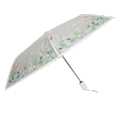 Paraguas plegable transparente con flor de hoja dibujada a mano