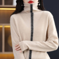 Woolen knit pullover with hem and pile neck
