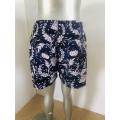 Vintage blommig totem herrstrandshorts