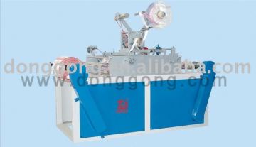 automatic film labeling/slitting/rewinding machine