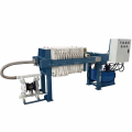 Slurry treatment system processing filter press