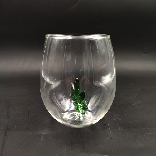 Heat resistant wine glass with green tree inside