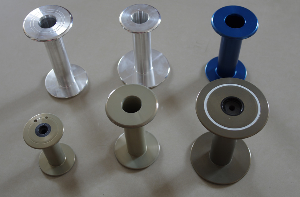 BOBBINS FOR COVERING AND TWISTING MACHINE