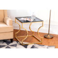 Mesa auxiliar geométrica dorada con vidrio gris ahumado