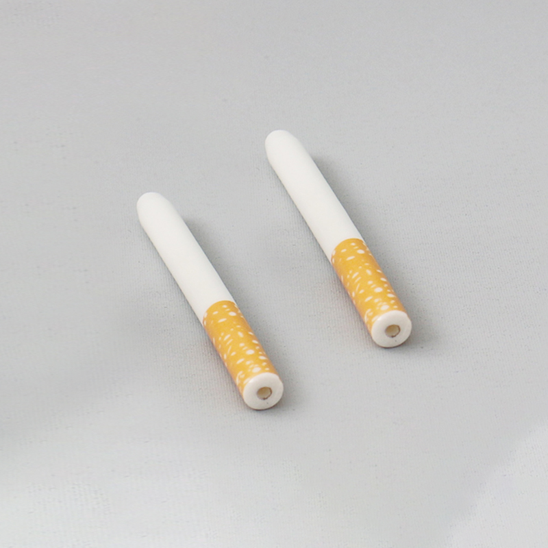 Ceramic cigarette holder and filter supplied