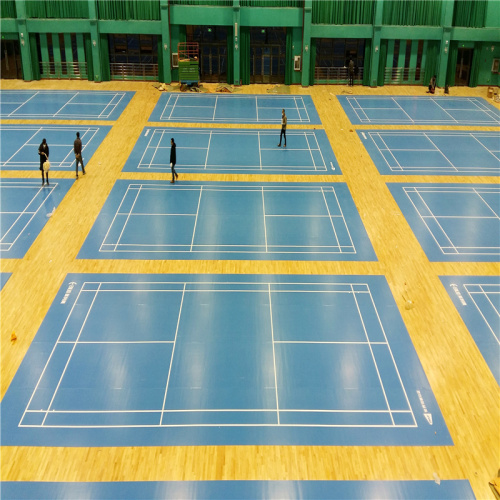 Green badminton sports flooring with white game line
