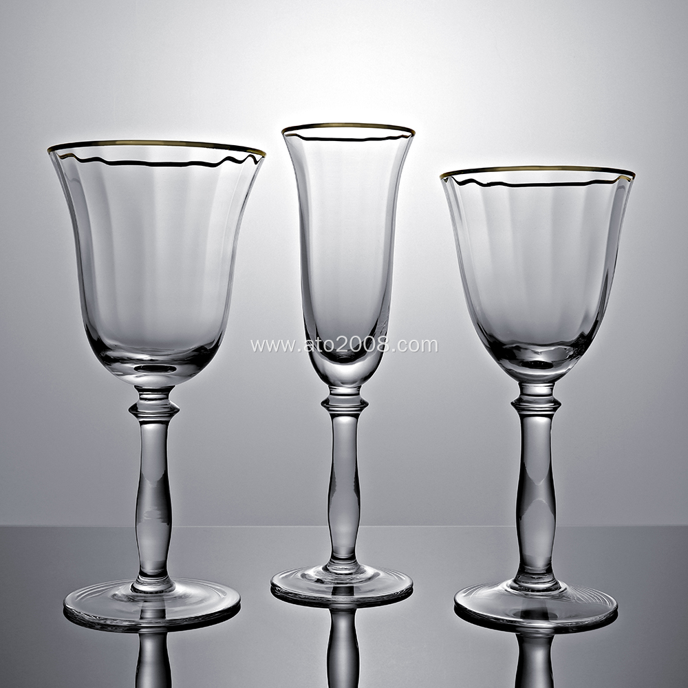 Gold rimmed crystal champagne flutes