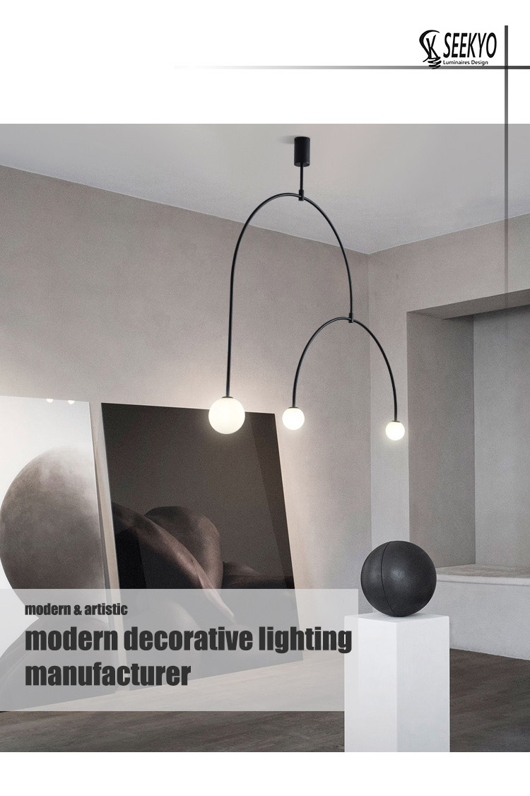 The semicircular balance 3 head glass ball pendant light is a stylish and modern lighting fixture that will add a touch of elegance to any room.