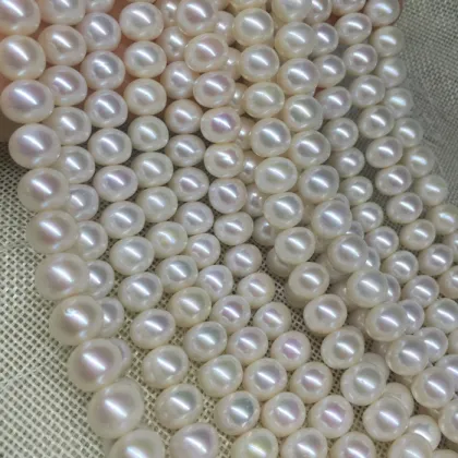 White or cream round fresh water loose water pearls with two holes for jewelry
