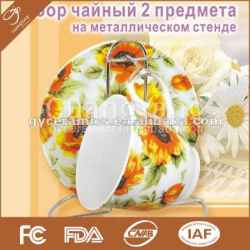 2 pcs porcelain tea set: 1 cup and 1 saucer with metal stand in color box