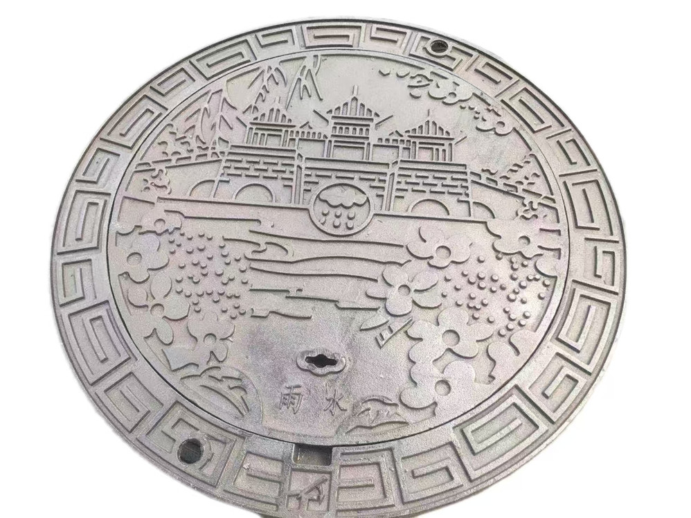 Artistic cast iron manhole cover