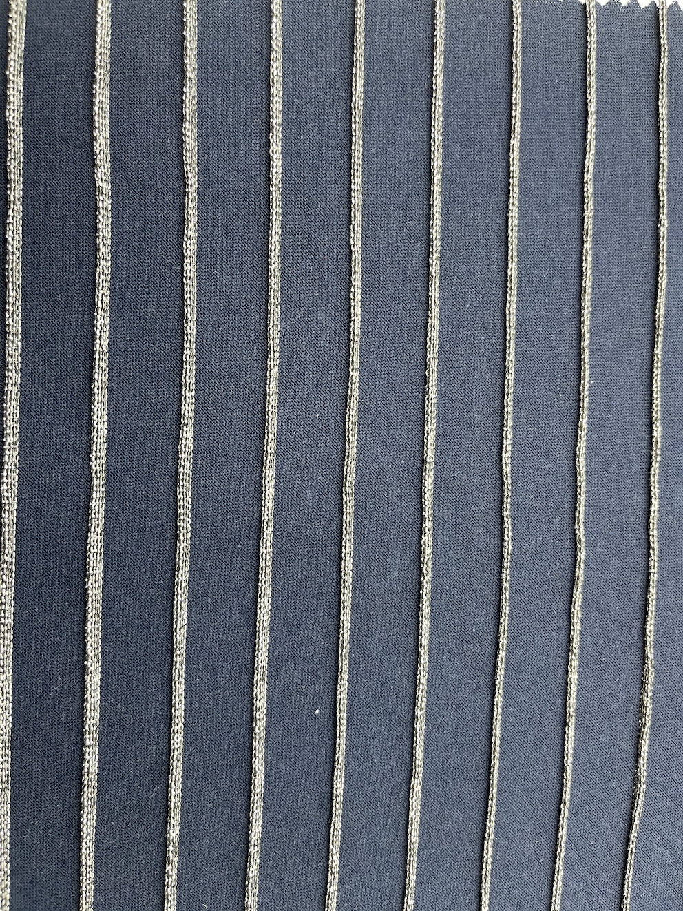 65% Polyester 25% Rayon 10% Lurex