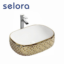 Lavabo de cerámica del lavabo del oro de lujo vendedor caliente