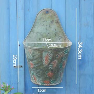 Wrought iron wall hanging painted feather iron bucket