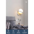 Spiral metal arm wall lamp opal glass shade
