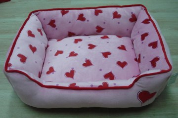 Pink calico dog bed