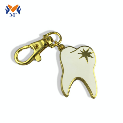 Llavero de oro personalizado con forma de dientes de metal