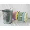 Hands on galvanized ice buckets