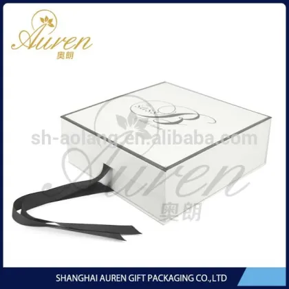 Plain white folding apparel boxes with ribbon