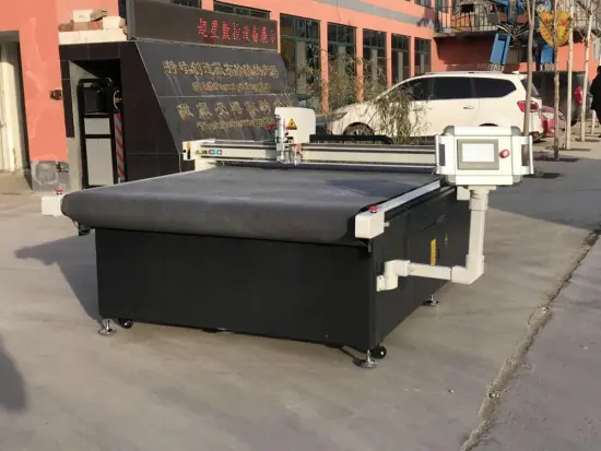 Oscillating knife cutting machine with loading system