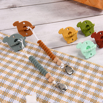 Cartoon Dinosaur silicone baby pacifier with chain clip