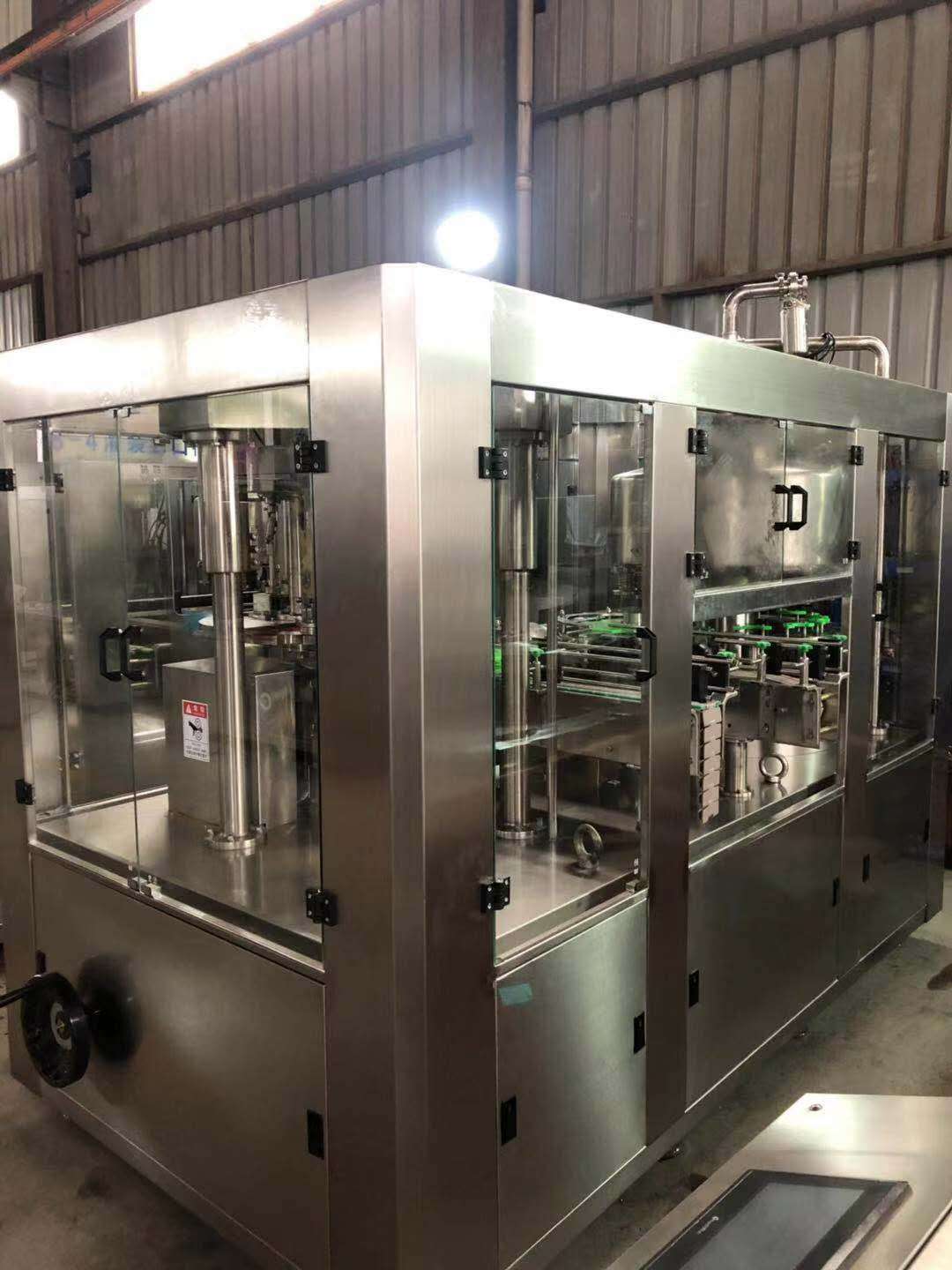 Filling and sealing machine for aluminum cans