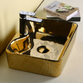 Golden and black color luxury ceramic wholesaler bathroom round washbasin with Counter top sink new design art basin
