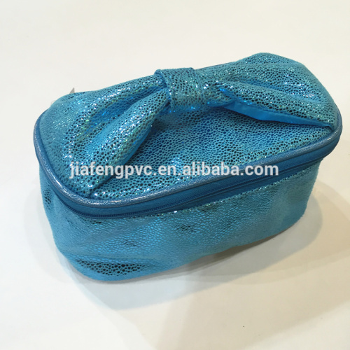 Shinning vanity bag with bowknot handle for cosmetics packing