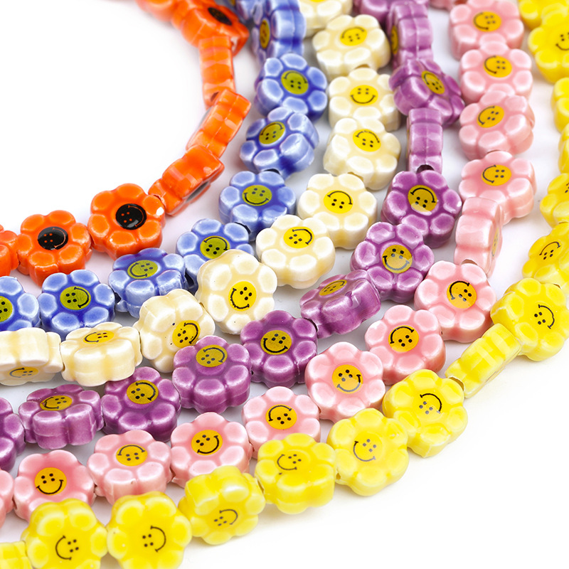 FLOWER AND SMILING CERAMIC STRUNG BEADS 10MM 30pcs