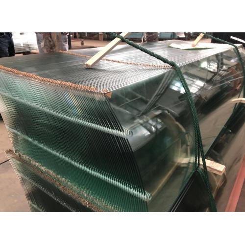 Bent double toughened laminated glass panels