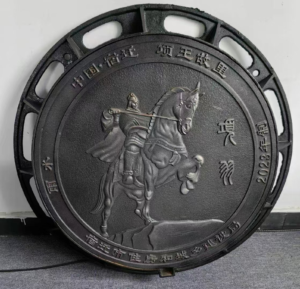 Artistic ductile iron manhole cover