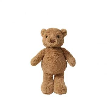 Crianças de urso marrom dormem com um brinquedo de pelúcia confortável