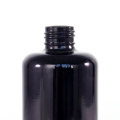 Black round shoulder glass bottle for essential oil