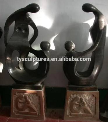 Stone abstract happy family in sculptures father and children statues