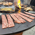 Corten steel fire pit with wooden grill bbq