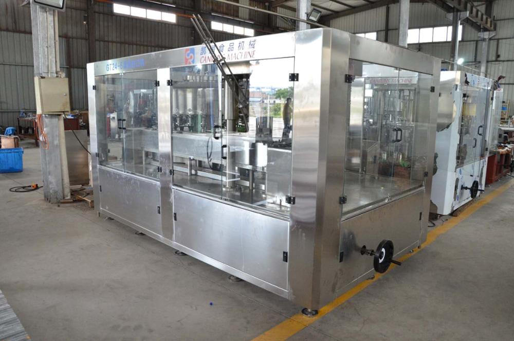 Filling and sealing machine for cans