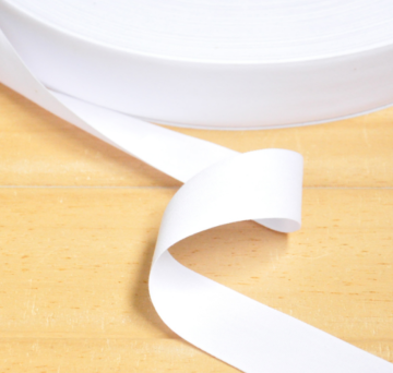 Reinforced decorative tape for pure cotton fabric