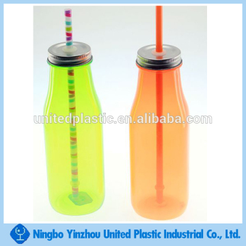 Plastic milk bottles with screw metal caps and straw