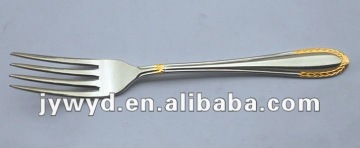 stainless steel dinner fork with golden on handle
