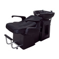 Черное кресло для мытья головы с откидной спинкой и подставкой для ног