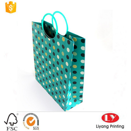 Bolsa de regalo de papel de lujo con asa de plástico