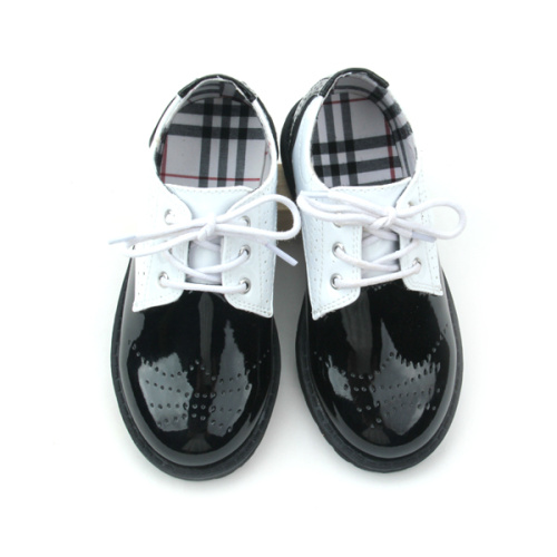 Количествени кожени черно-бели детски ежедневни обувки