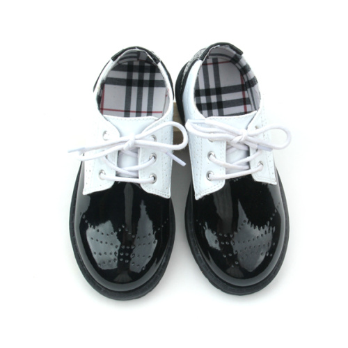 Zapatos casuales para niños en blanco y negro de cuero de Quanlity