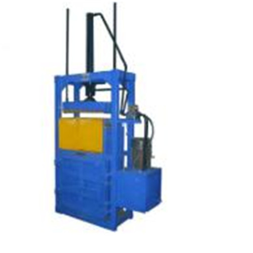 Waste paperboard baler machine