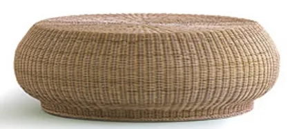 A set of rattan woven cushions and coffee tables